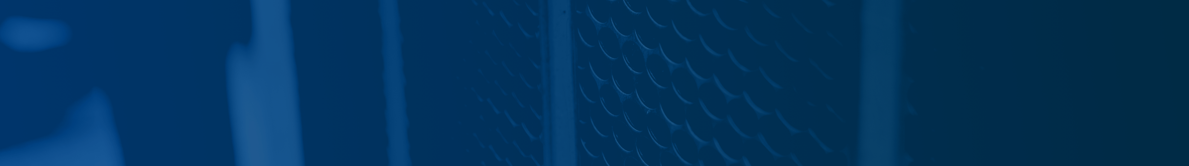 Need a Repair You Can Trust? Blue background with grill of truck up close at L&M Maintenance and Equipment
