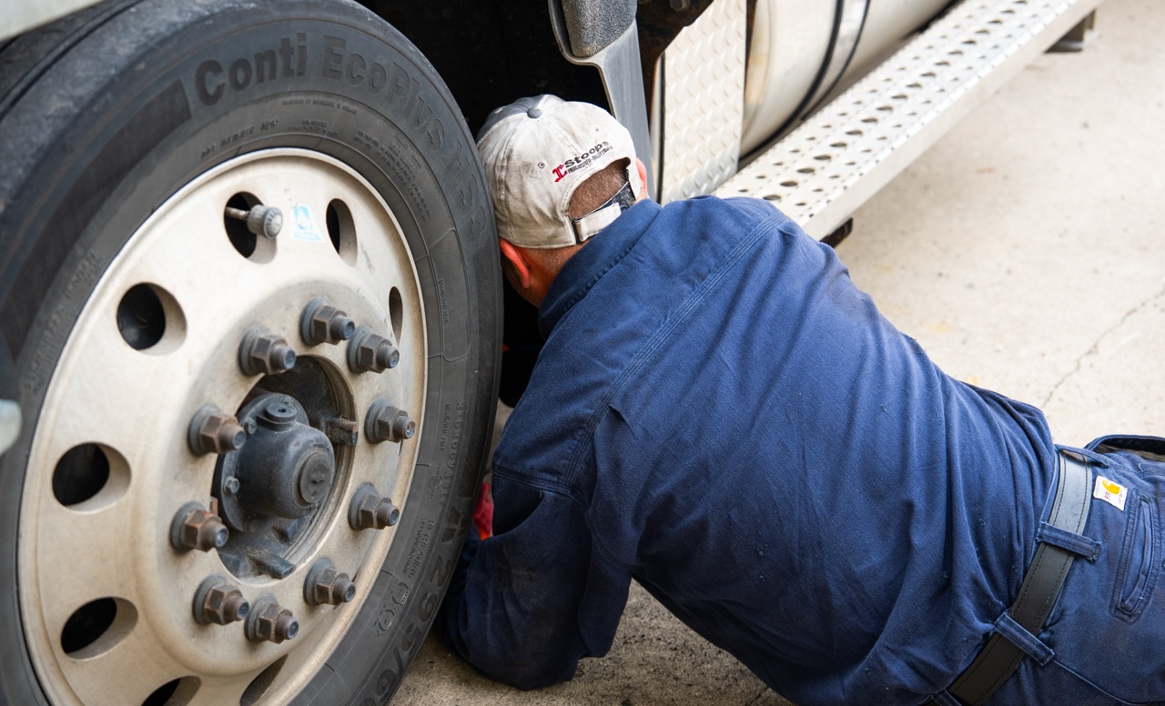 L&M Maintenance and Equipment mechanic working on truck